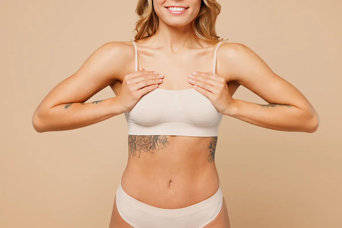 Woman cupping her breasts